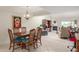 Dining area with wood table and chairs, kitchen view at 25244 S Saddletree Dr, Sun Lakes, AZ 85248