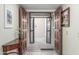 Bright entryway with double doors and a half-moon table at 25244 S Saddletree Dr, Sun Lakes, AZ 85248
