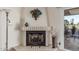 Fireplace with decorative screen and adjacent seating at 25244 S Saddletree Dr, Sun Lakes, AZ 85248