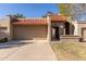 Tan garage with terracotta tile roof at 25244 S Saddletree Dr, Sun Lakes, AZ 85248
