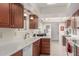 Kitchen with wood cabinets and white countertops at 25244 S Saddletree Dr, Sun Lakes, AZ 85248