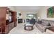 Living room with fireplace, patio access, and comfortable seating at 25244 S Saddletree Dr, Sun Lakes, AZ 85248