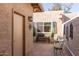 Small patio with table and chairs at 25244 S Saddletree Dr, Sun Lakes, AZ 85248