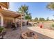 Relaxing patio with fire pit and seating area at 25244 S Saddletree Dr, Sun Lakes, AZ 85248