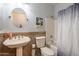 Clean bathroom with pedestal sink, toilet, and shower/tub combo at 2734 E Birchwood Pl, Chandler, AZ 85249