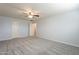 Spacious bedroom with ceiling fan and double doors at 2734 E Birchwood Pl, Chandler, AZ 85249