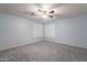 Well-lit bedroom with carpeted floors and ceiling fan at 2734 E Birchwood Pl, Chandler, AZ 85249