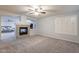 Spacious bedroom with fireplace and view into another room at 2734 E Birchwood Pl, Chandler, AZ 85249