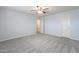 Spacious bedroom with ceiling fan and double doors at 2734 E Birchwood Pl, Chandler, AZ 85249