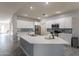 Modern kitchen featuring a large island, white cabinets, and stainless steel appliances at 2734 E Birchwood Pl, Chandler, AZ 85249