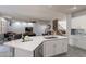 Open kitchen with large island, view of living room and staircase at 2734 E Birchwood Pl, Chandler, AZ 85249
