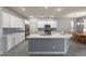 Eat-in kitchen with island, white cabinets, stainless steel appliances, and a dining area at 2734 E Birchwood Pl, Chandler, AZ 85249