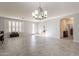 Spacious living room with tile floors and large windows at 2734 E Birchwood Pl, Chandler, AZ 85249