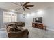 Bright living room featuring tile floors and a ceiling fan at 2734 E Birchwood Pl, Chandler, AZ 85249