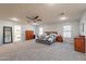 Spacious main bedroom with carpeted floors and ceiling fan at 2734 E Birchwood Pl, Chandler, AZ 85249
