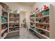 Well-stocked pantry with ample shelving for storage at 2734 E Birchwood Pl, Chandler, AZ 85249
