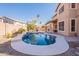 Inviting kidney-shaped pool with water feature in backyard at 2734 E Birchwood Pl, Chandler, AZ 85249