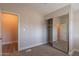 Small bedroom with mirrored closet and neutral wall paint at 3710 W Irma Ln, Glendale, AZ 85308