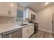 Updated kitchen featuring white shaker cabinets and stainless steel appliances at 3710 W Irma Ln, Glendale, AZ 85308