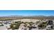 Aerial view of a vacant lot surrounded by houses and mountain views at 3841 N 293Rd Dr, Buckeye, AZ 85396