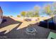 Landscaped backyard with a hot tub, pergola, and stone pathway at 3841 N 293Rd Dr, Buckeye, AZ 85396