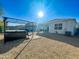 Backyard oasis featuring a hot tub under a pergola and a gravel patio at 3841 N 293Rd Dr, Buckeye, AZ 85396