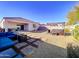 Relaxing backyard with a hot tub, fire pit, and comfortable seating at 3841 N 293Rd Dr, Buckeye, AZ 85396