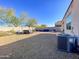 Spacious backyard with a hot tub, pergola, and patio furniture at 3841 N 293Rd Dr, Buckeye, AZ 85396