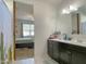 Double vanity bathroom with dark cabinetry and a shower at 3841 N 293Rd Dr, Buckeye, AZ 85396