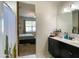 Main bathroom with double vanity and access to bedroom at 3841 N 293Rd Dr, Buckeye, AZ 85396