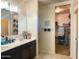 Bathroom with double vanity and access to closet at 3841 N 293Rd Dr, Buckeye, AZ 85396