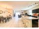 Open concept dining area with kitchen and living room views at 3841 N 293Rd Dr, Buckeye, AZ 85396