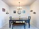 Bright dining room with a table, bench, and chandelier at 3841 N 293Rd Dr, Buckeye, AZ 85396