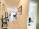 Entryway with glass-top table and view into living room at 3841 N 293Rd Dr, Buckeye, AZ 85396