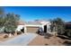 One-story house with a brown garage door and desert landscaping at 3841 N 293Rd Dr, Buckeye, AZ 85396