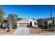 One-story house with a brown garage door and desert landscaping at 3841 N 293Rd Dr, Buckeye, AZ 85396
