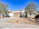 Single-story home with a two-car garage and desert landscaping at 3841 N 293Rd Dr, Buckeye, AZ 85396