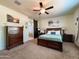 Large main bedroom with carpeted floors and a ceiling fan at 3841 N 293Rd Dr, Buckeye, AZ 85396