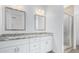 Double vanity bathroom with granite countertops and a shower at 39112 N 9Th Ave, Phoenix, AZ 85086