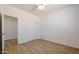 Bright bedroom with ceiling fan and double door closet at 39112 N 9Th Ave, Phoenix, AZ 85086