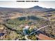 Aerial view showcasing a house with a pool and expansive mountain and desert views at 39775 N 50Th St, Cave Creek, AZ 85331