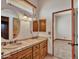 Bathroom with double vanity and a view into another bedroom at 39775 N 50Th St, Cave Creek, AZ 85331