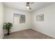 Bright bedroom with ceiling fan, carpet, and large window at 4268 N 81St St, Scottsdale, AZ 85251