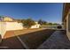 Spacious backyard featuring a basketball hoop, dome climber, and BBQ, perfect for outdoor activities at 4747 S Aileron Ln, Mesa, AZ 85212
