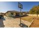 Large backyard featuring a basketball hoop, play structure and nice patio at 4747 S Aileron Ln, Mesa, AZ 85212