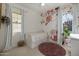 Charming bedroom boasts floral wallpaper, a trundle bed, and natural light at 4747 S Aileron Ln, Mesa, AZ 85212
