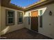 Home entrance featuring a brown front door with a tiled exterior at 4747 S Aileron Ln, Mesa, AZ 85212