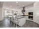 Spacious kitchen with granite counters, stainless appliances, and large island at 4747 S Aileron Ln, Mesa, AZ 85212