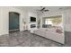 Cozy living room with a fireplace, ship lap accent wall, tile flooring, and sliding glass doors to the backyard at 4747 S Aileron Ln, Mesa, AZ 85212