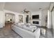 Bright, open living room with fireplace and a large comfortable couch at 4747 S Aileron Ln, Mesa, AZ 85212